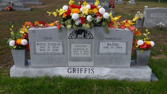 HEADSTONE AND VASE FLOWER